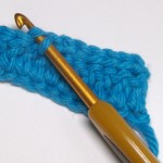 Cape step 3 - slip stitch in the back loop of each DC from the previous row